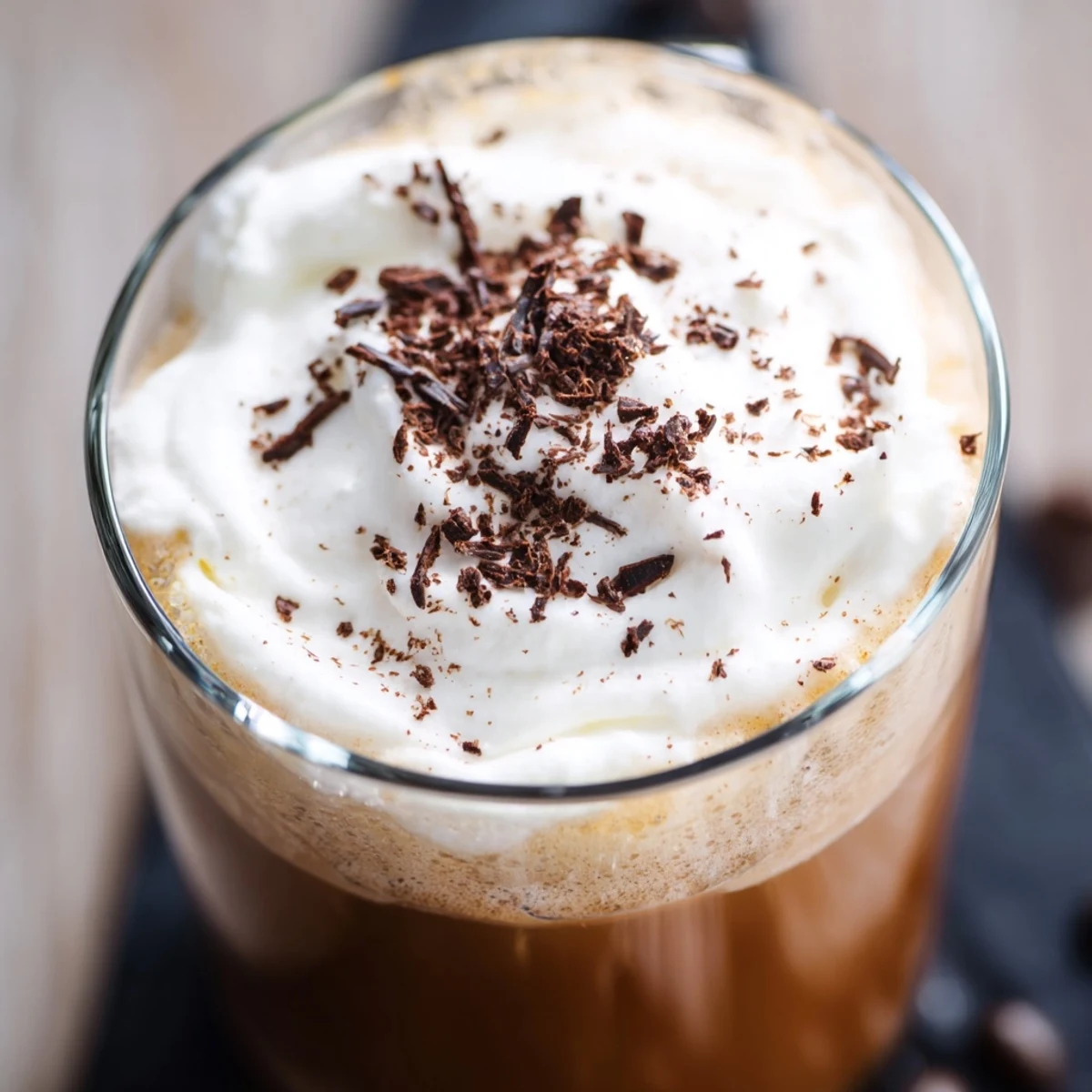 Irish Coffee Mocktail served in a heatproof mug, topped with a floating cream swirl and cinnamon dusting.