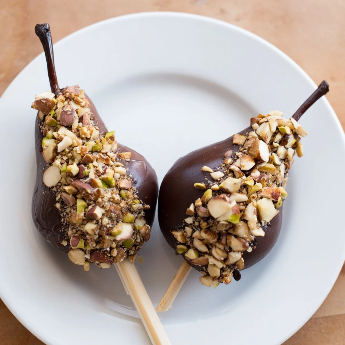 Chocolate Covered Pears with Nuts arranged on a platter, perfect for an elegant dessert party or a romantic night in.
