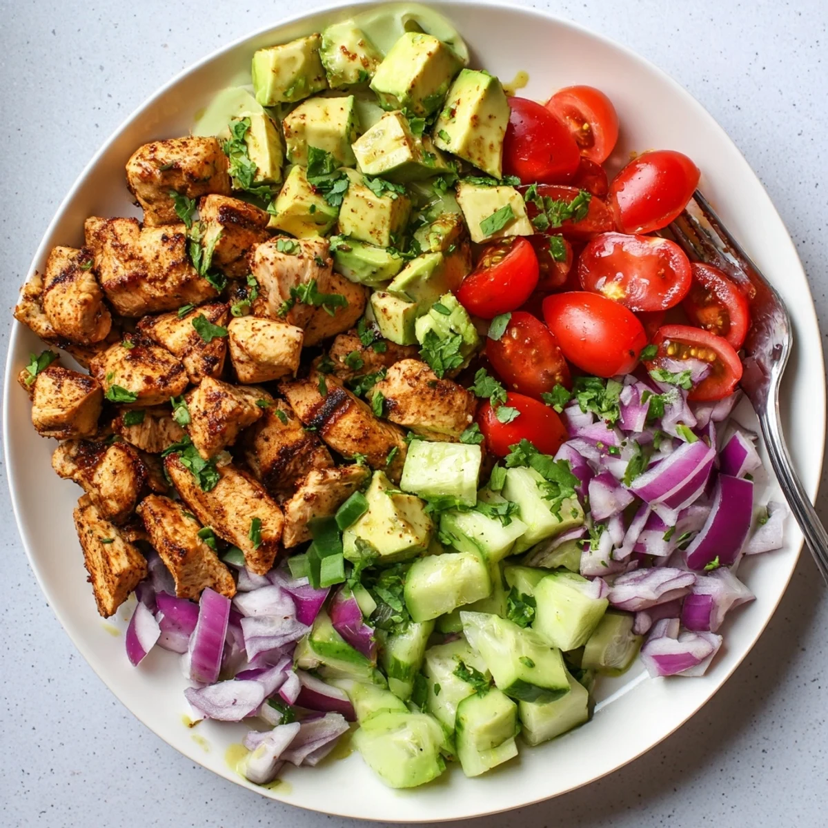 You can imagine Avocado Chicken Salad served on a bed of greens with red onion and cucumber for crunch.