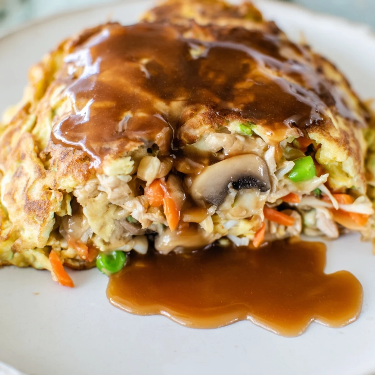 Golden crispy Egg Foo Young patties topped with rich savory brown gravy