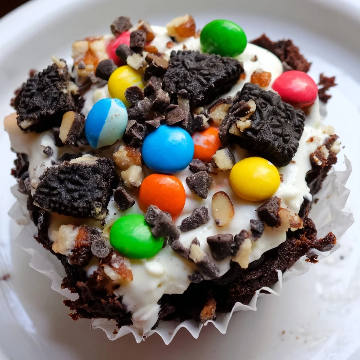Decadent brownie cheesecake cups swirled with creamy vanilla filling and crushed Oreo cookies