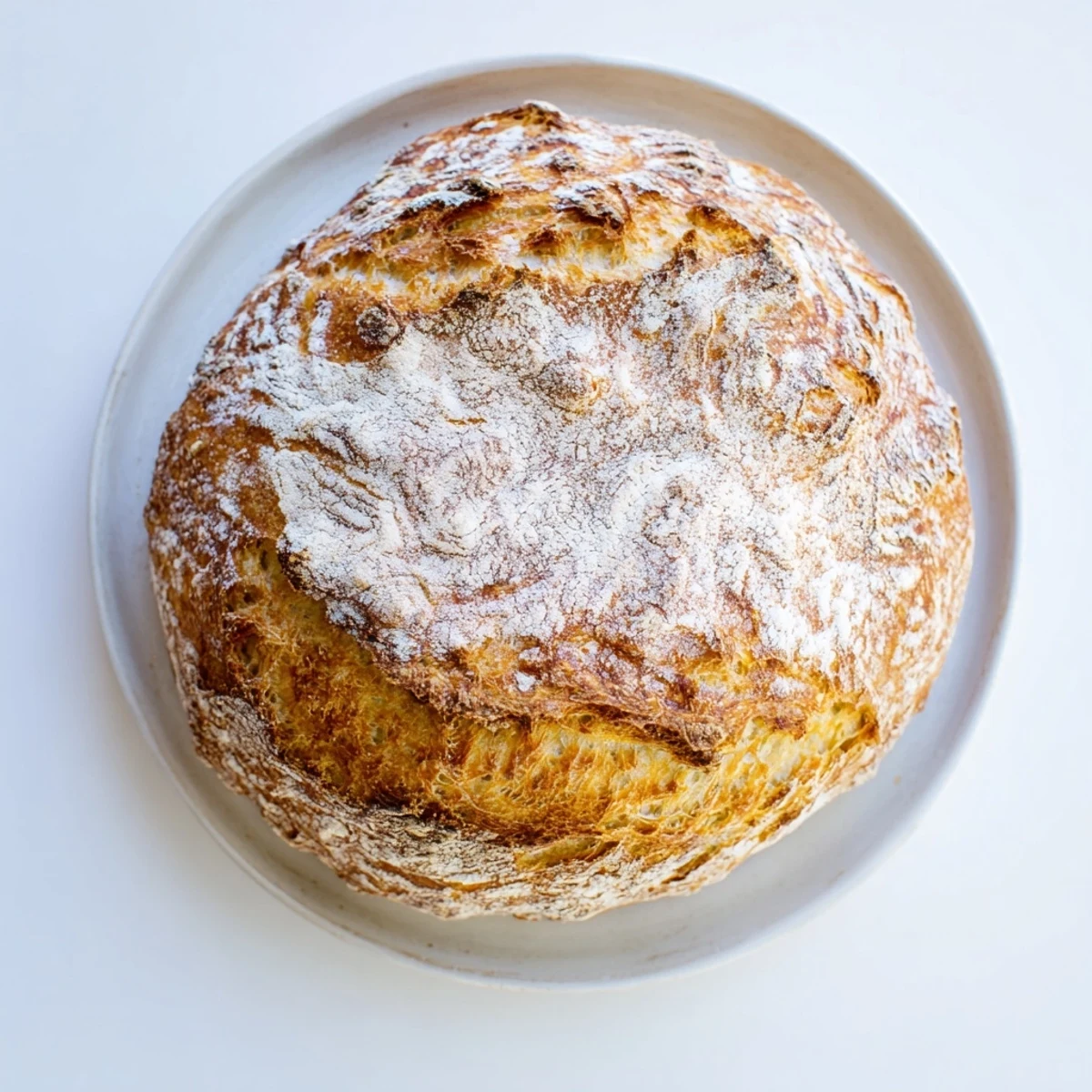 Freshly baked foolproof artisan no knead bread loaf cooling on wire rack