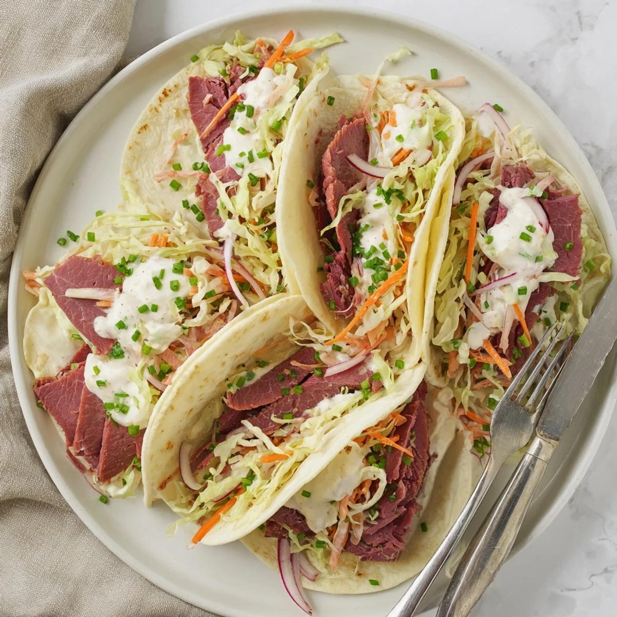 Fresh Irish tacos loaded with tender corned beef and crunchy cabbage slaw