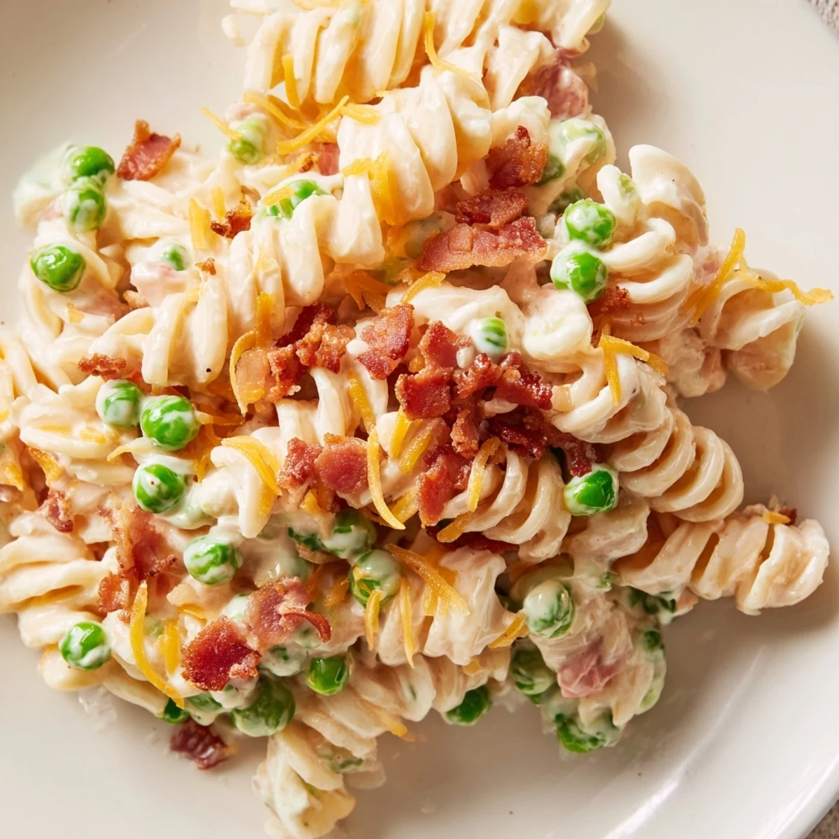 Creamy crack pasta salad with crispy bacon, cheddar, and ranch-coated rotini noodles