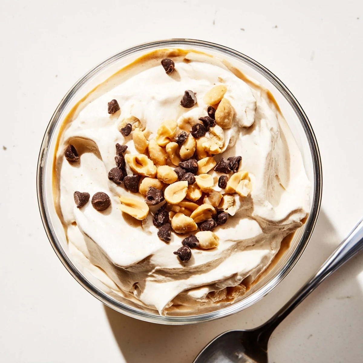 Creamy peanut butter and Cool Whip mousse topped with chocolate shavings in dessert glasses