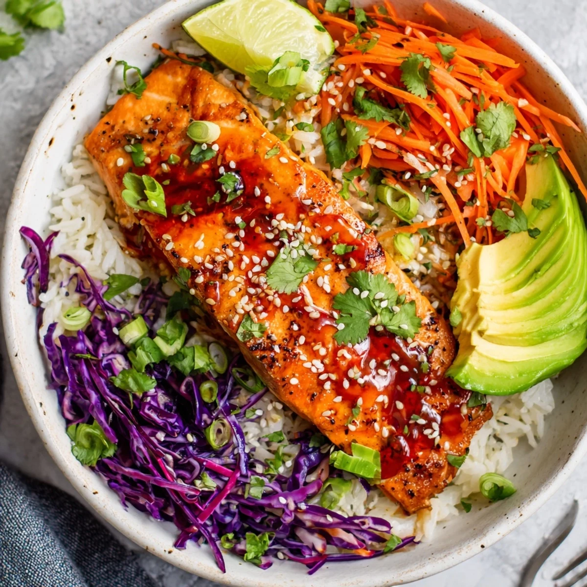 Bang Bang Salmon Bowls Recipe with oven roasted salmon over fluffy jasmine rice
