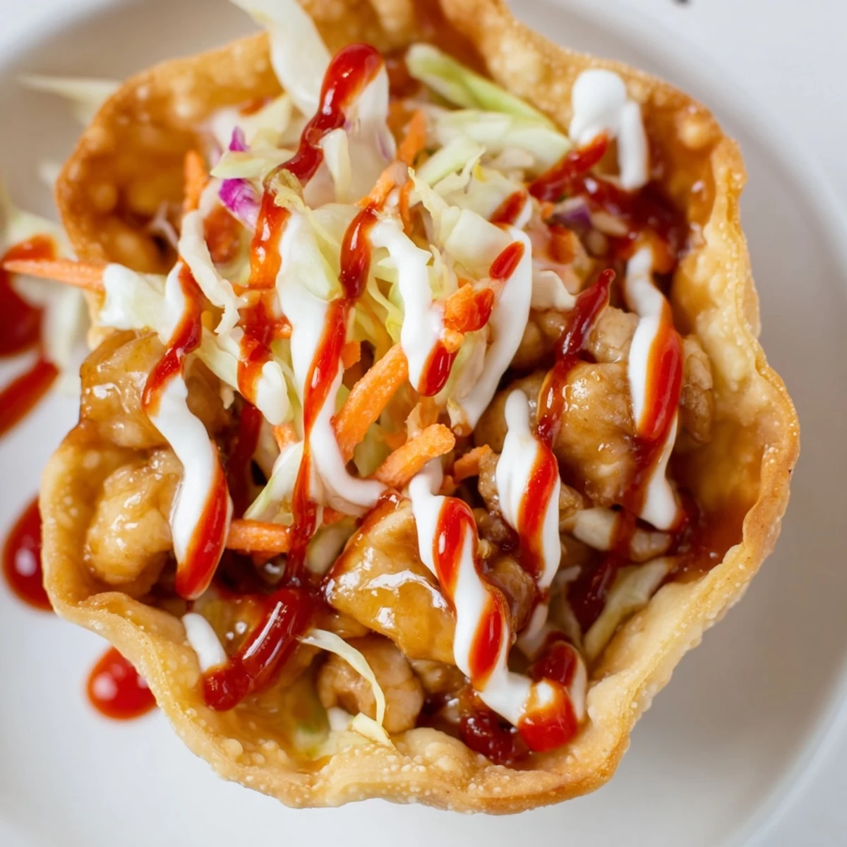 Asian fusion appetizer featuring crunchy wonton shells filled with savory seasoned chicken and fresh vegetables