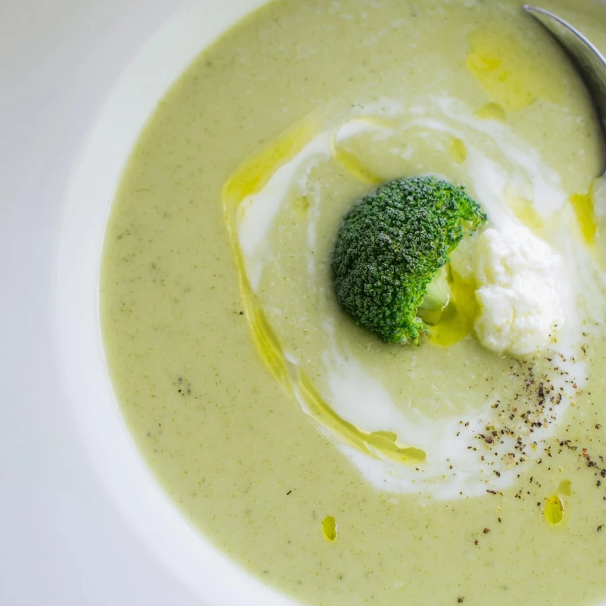 Hot Broccoli Soup ladled over crusty bread, bright green and velvety